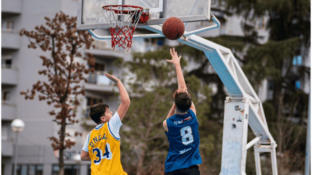 Young Men playing Basketball